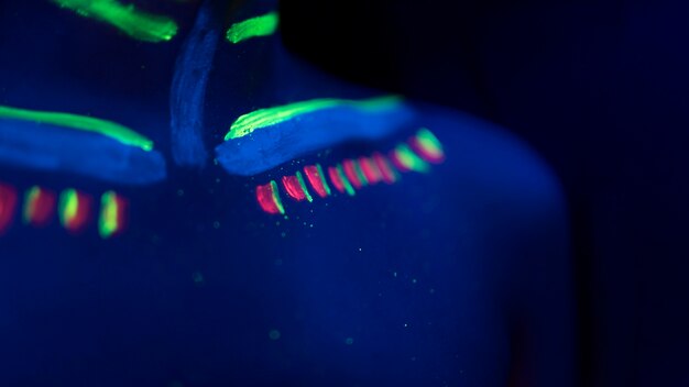 Close-up view of colorful fluorescent make-up