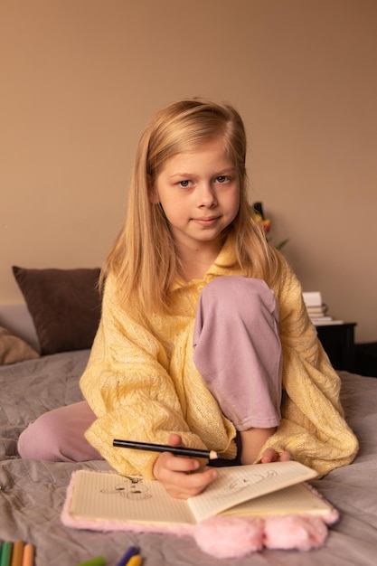 Close up view of cute girl sitting at room look at camera