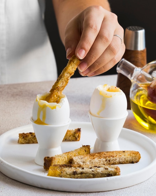 Close-up view of delicious egg with bread sticks