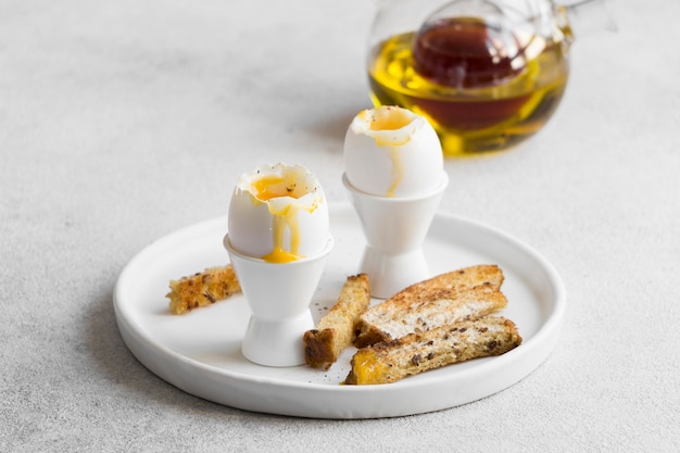 Close-up view of delicious egg with bread sticks