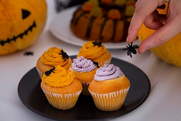 Close-up view of delicious halloween cupcakes