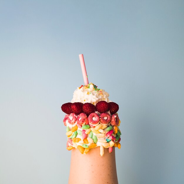 Close-up view of delicious milkshake on plain background