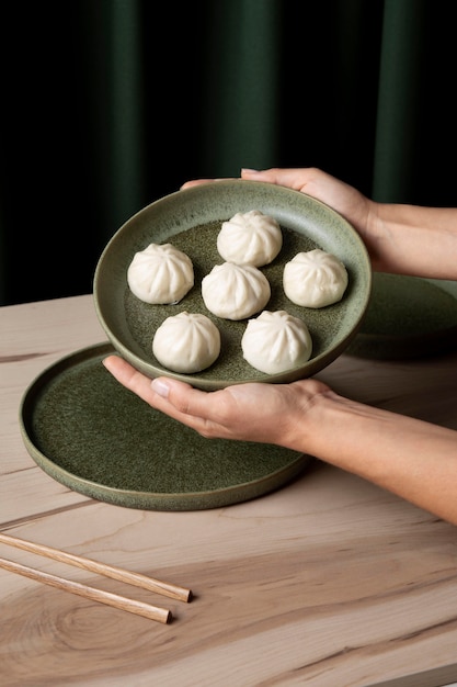 Free photo close-up view of dumplings on wooden table
