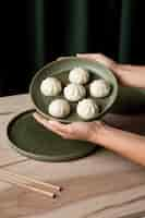 Free photo close-up view of dumplings on wooden table