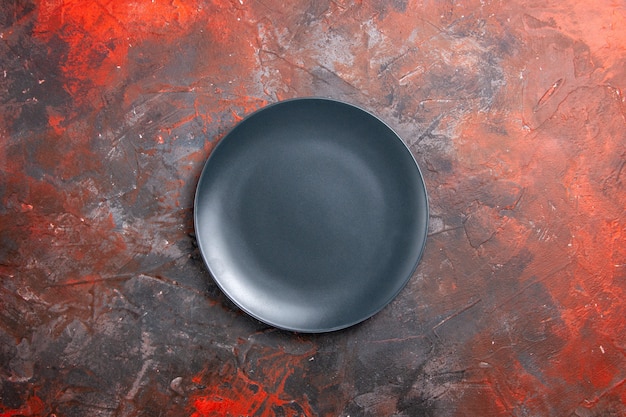 Close up view of empty black plate on black