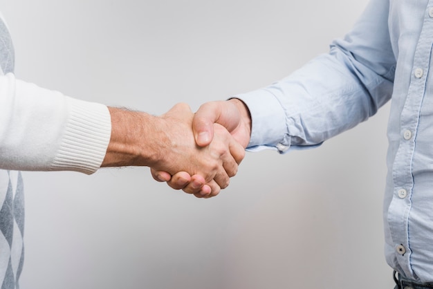 Close-up view of father and son hands