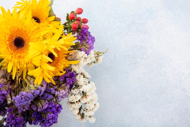 Close up view of flowers on white surface