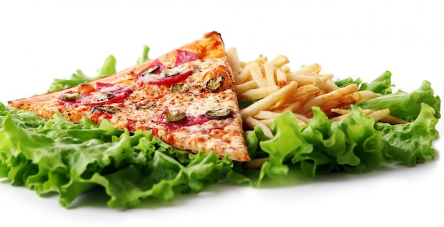 Close up view of fresh pizza with french fries