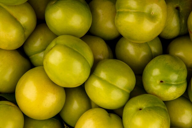 Close-up view of green plums for background uses