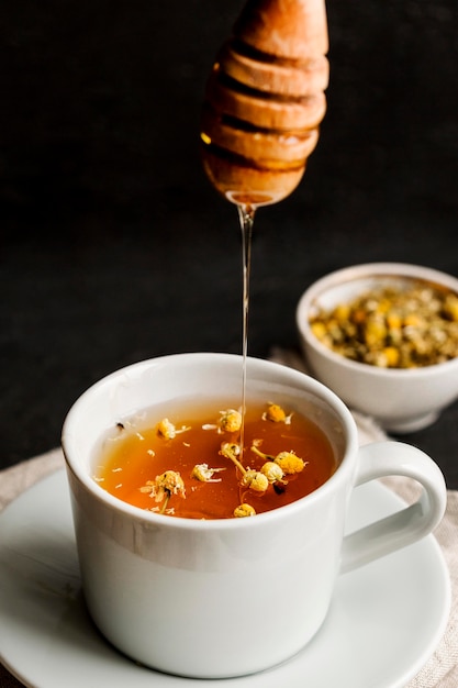 Close-up view of herbal tea concept with honey