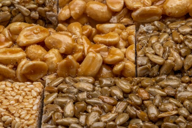 Close up view of honey bars with peanuts sesame and sunflower seeds