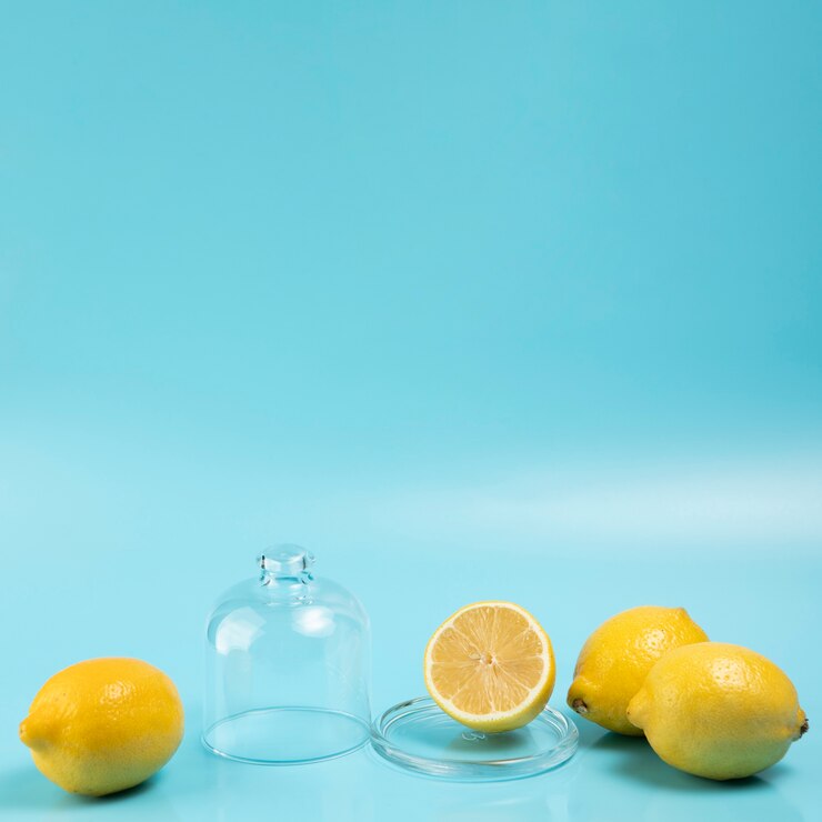 Free Photo close up view of lemons on blue background