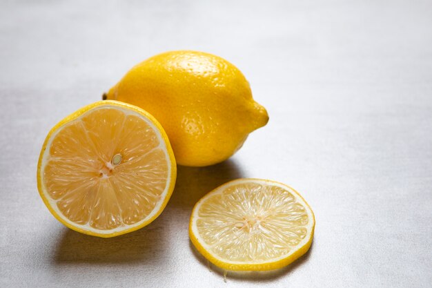 Close-up view of lemons on plain background