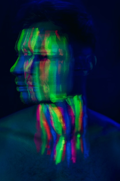 Close-up view of man with fluorescent make-up