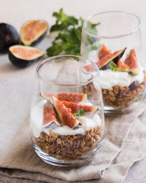Close-up view of muesli with figs in glass