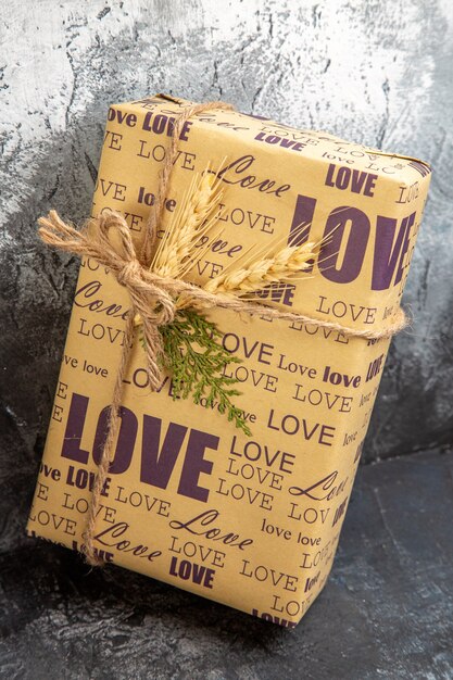 Close up view of packed gift standing on wall