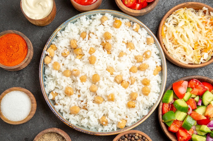 Free Photo close up view of peas and rice meal sauerkraut salad mayonnaise spices and ketchup on dark table