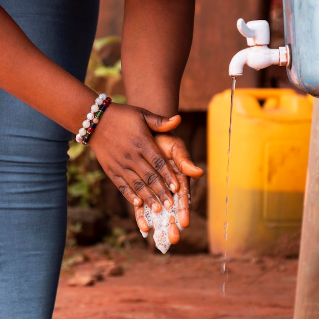 Close-up view of person washing hands