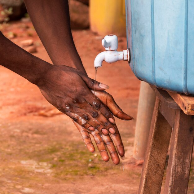 Close-up view of person washing hands