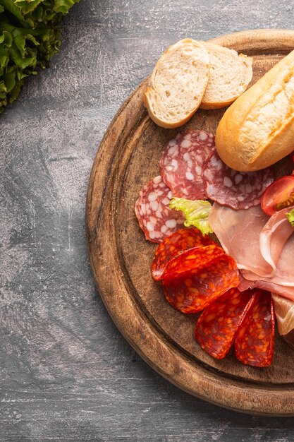 Close-up view of salami an tomatoes on plate