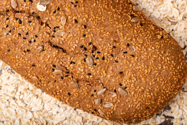 Close-up view of sandwich bread on oat background