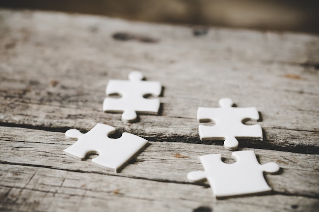 A close up view of several white jigsaw puzzle pieces