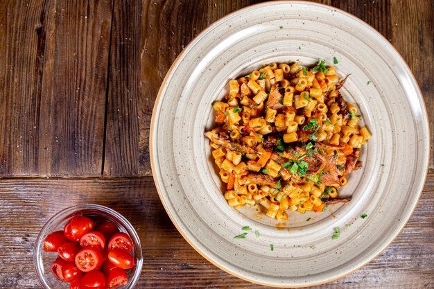 Close up view of short pasta with octopus