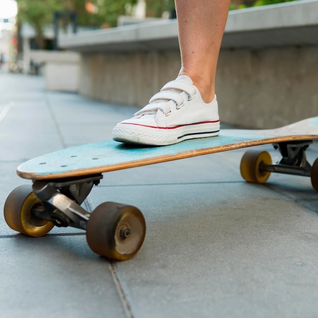 Close-up view of skateboard in urban city