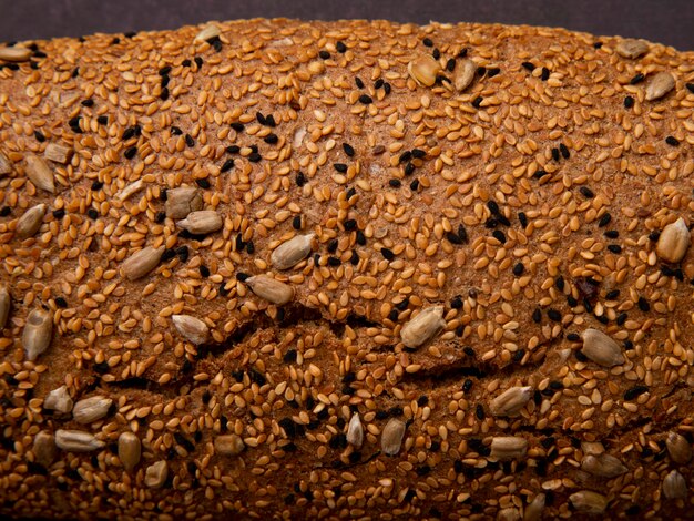 Close-up view of sunflower seeds on baguette bread