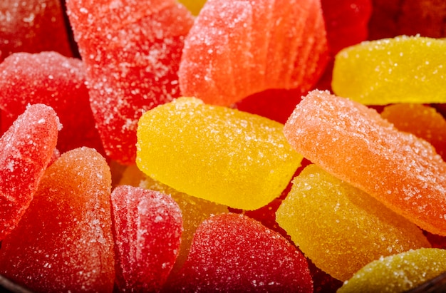 Close up view of tasty marmalade candies with different colors