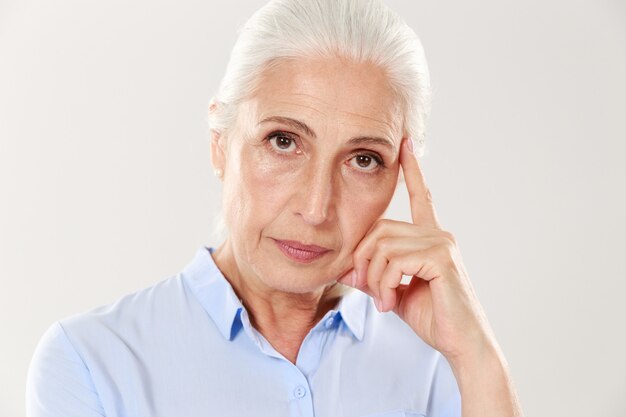 Close-up view of thinking old lady