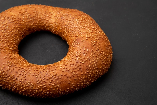 Close-up view of turkish bagel on black background with copy space