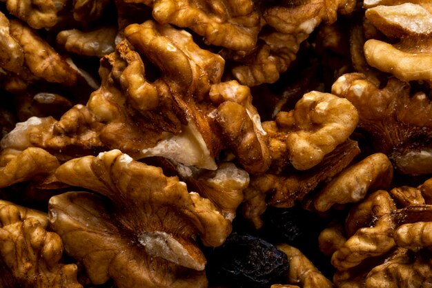 Close up view of walnuts scattered on rustic