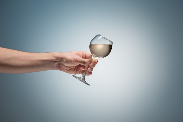 Close-up view of white wine glass