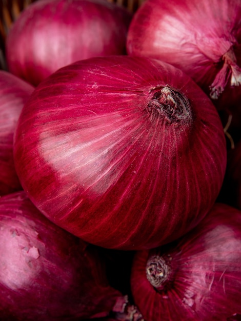 Close-up view of whole red onions