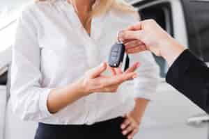 Free photo close-up view of a woman receiving car key