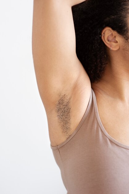 Close-up view of a woman showing her armpit