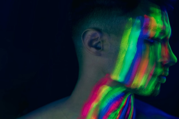 Close-up view of woman with fluorescent make-up