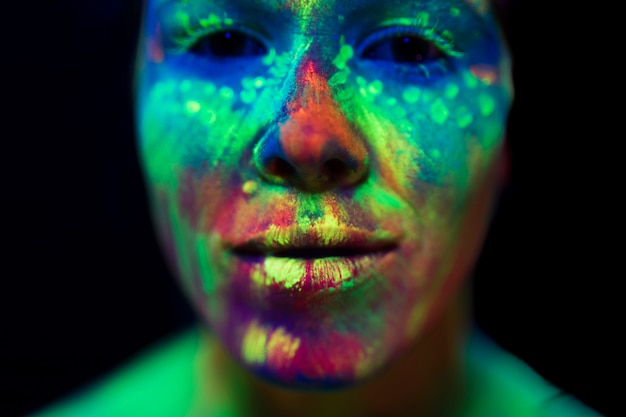 Free photo close-up view of woman with fluorescent make-up