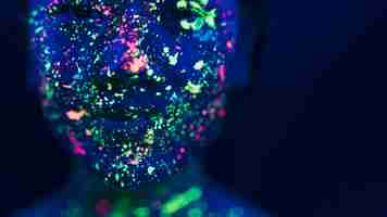 Free photo close-up view of woman with fluorescent make-up