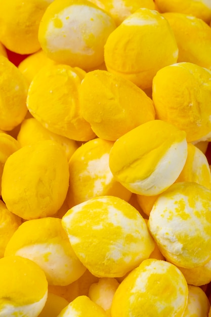 Close up view of yellow sweet sugar candies pattern