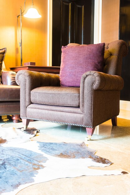 Close-up of vintage armchair with a cushion