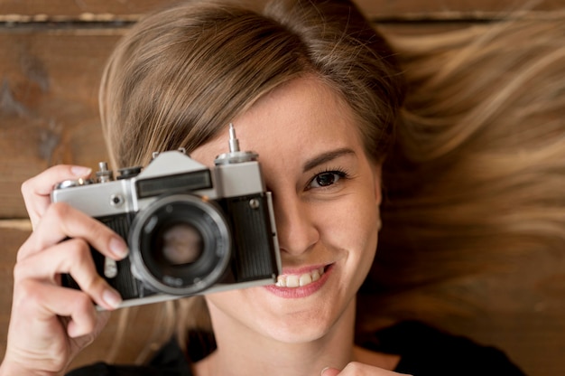 Close-up vintage camera photo and blurred girl