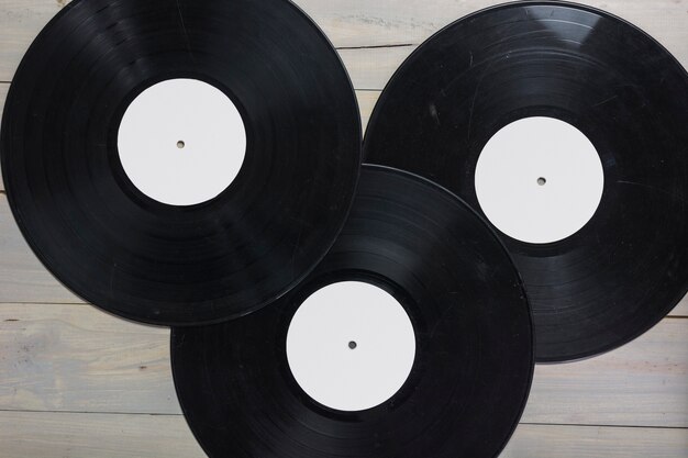 Close-up of vinyl records on wooden table