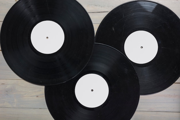 Close-up of vinyl records on wooden table