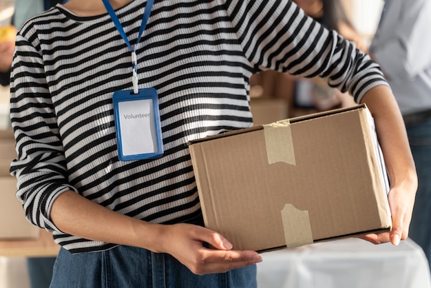 Close up volunteer holding box