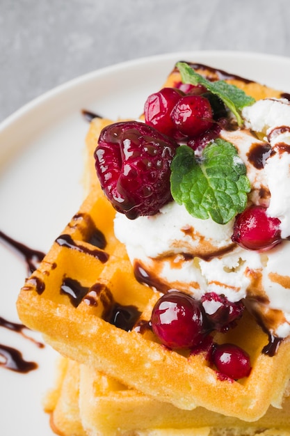 Close-up waffles with ice cream and fruits