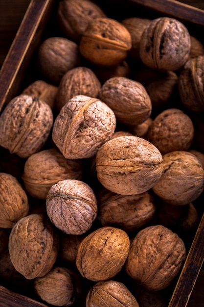 Close up walnuts in wooden box