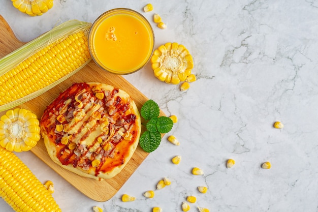 Close up on warm corn pizza ready to eat