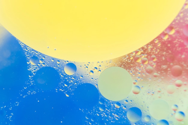 Free photo close-up of water bubbles floating on beautiful watercolor background